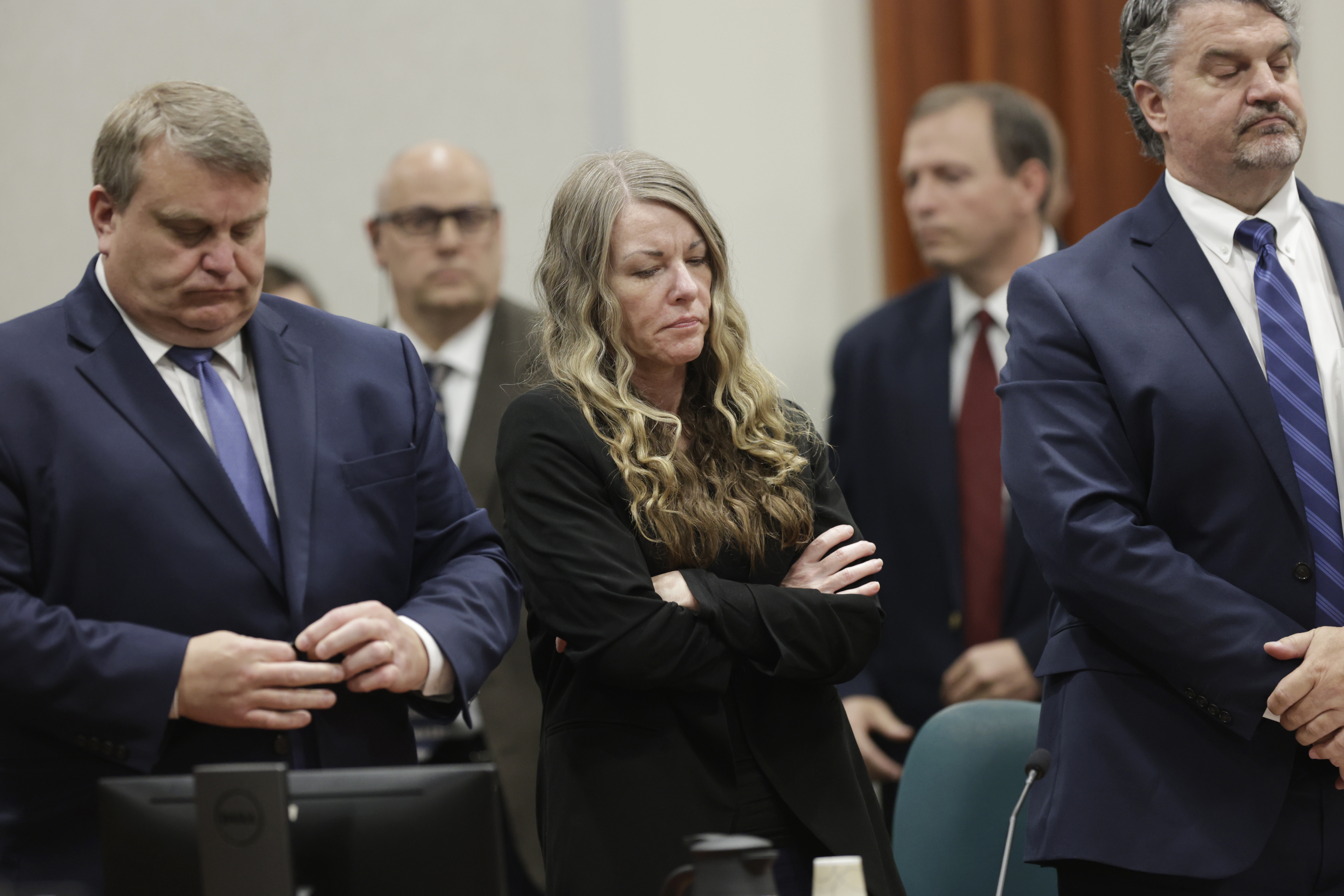 FILE - Lori Vallow Daybell stands and listens as the jury's verdict is read at the Ada County Courthouse in Boise, Idaho, May 12, 2023. The trial of Chad Daybell, the man charged with the deaths of his wife and his girlfriend's two youngest children, is set to begin in Idaho on Monday, April 1, 2024, serving as a second act in a bizarre case that has drawn worldwide attention and already resulted in a life sentence for the kids' mother, Lori Vallow Daybell. (AP Photo/Kyle Green, File)