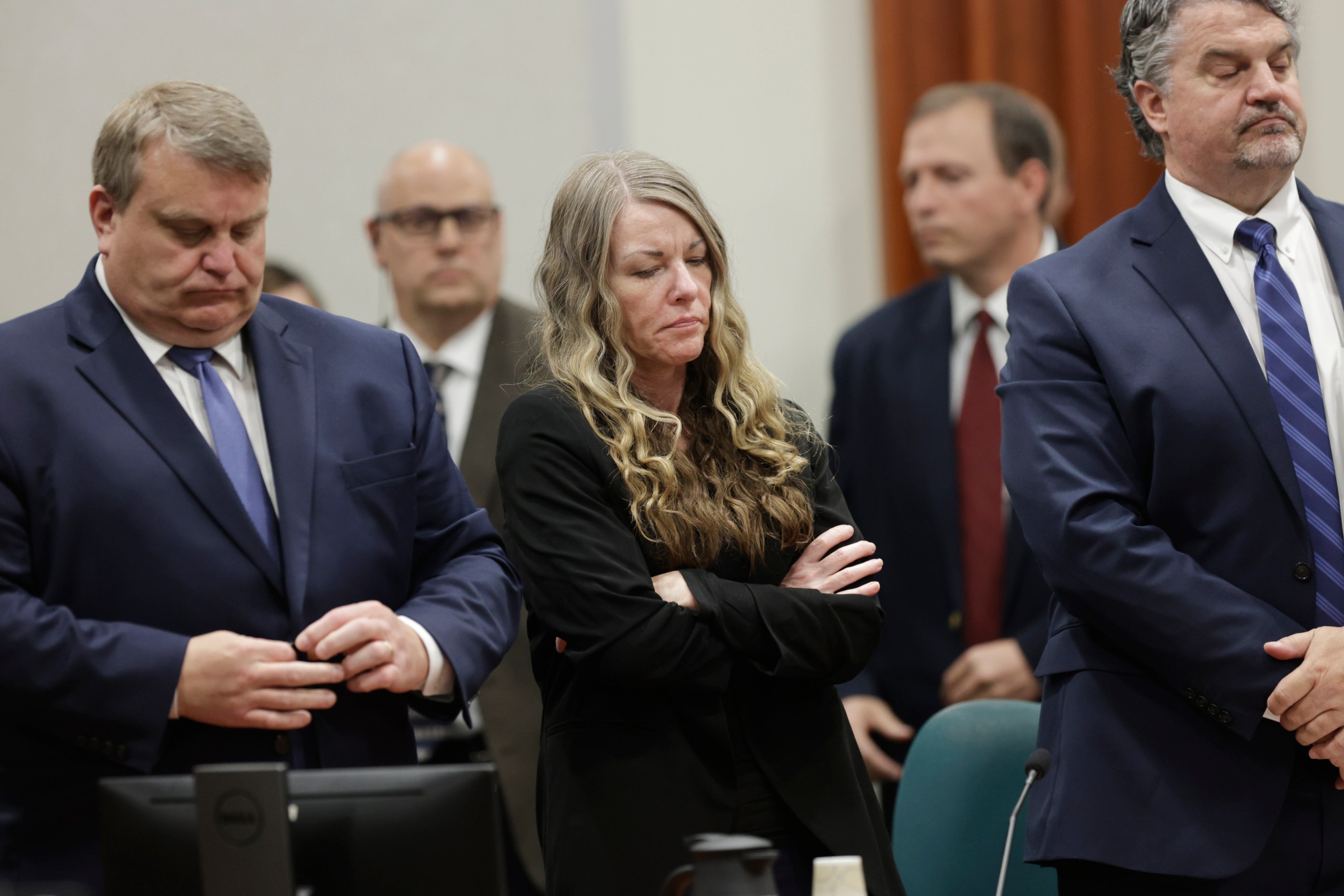 FILE - Lori Vallow Daybell stands and listens as the jury's verdict is read at the Ada County Courthouse in Boise, Idaho, May 12, 2023. The trial of Chad Daybell, the man charged with the deaths of his wife and his girlfriend's two youngest children, is set to begin in Idaho on Monday, April 1, 2024, serving as a second act in a bizarre case that has drawn worldwide attention and already resulted in a life sentence for the kids' mother, Lori Vallow Daybell. (AP Photo/Kyle Green, File)