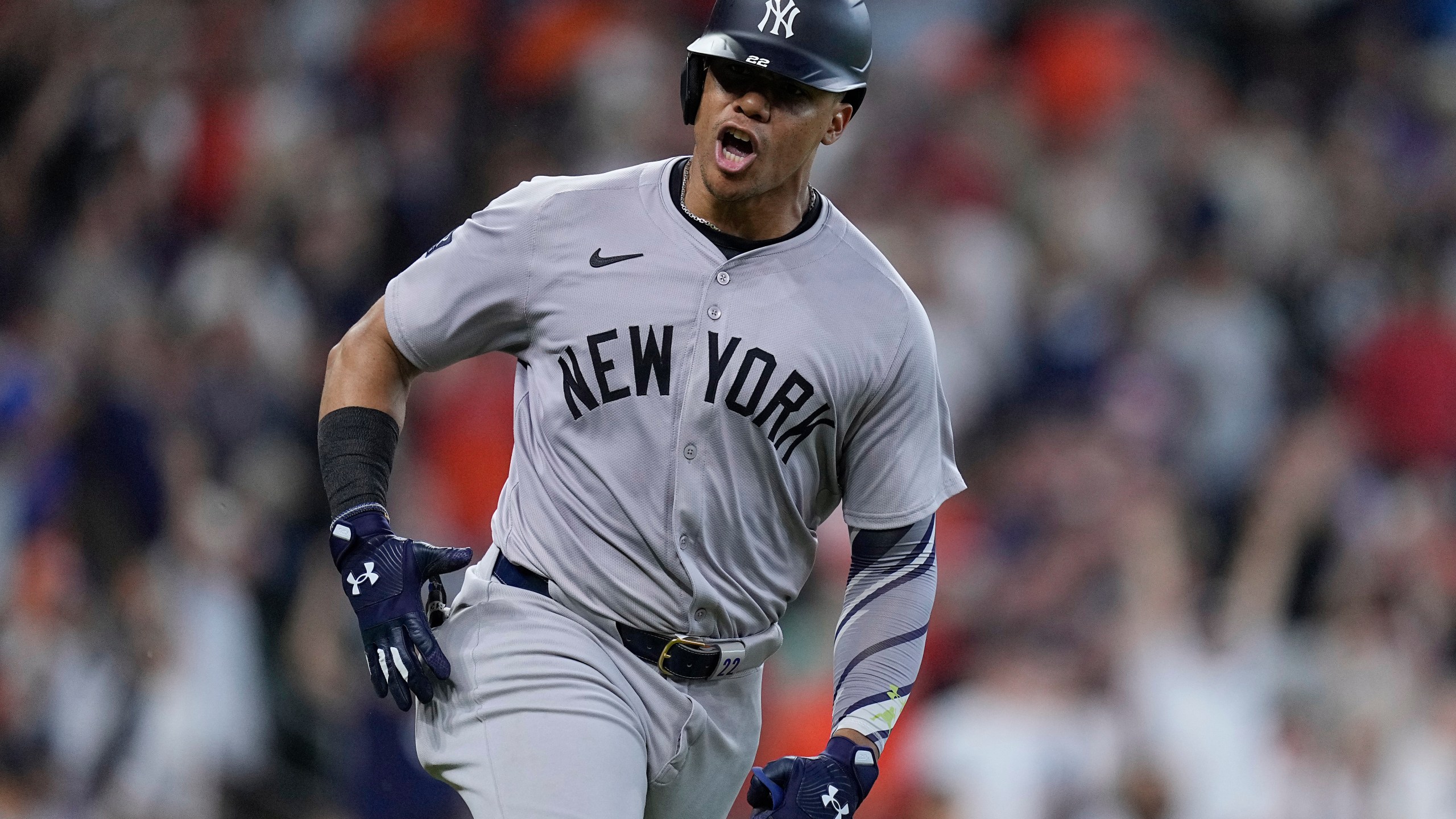 New York Yankees' Juan Soto celebrates after hitting an RBI single during the ninth inning of the team's baseball game against the Houston Astros, Sunday, March 31, 2024, in Houston. (AP Photo/Kevin M. Cox)