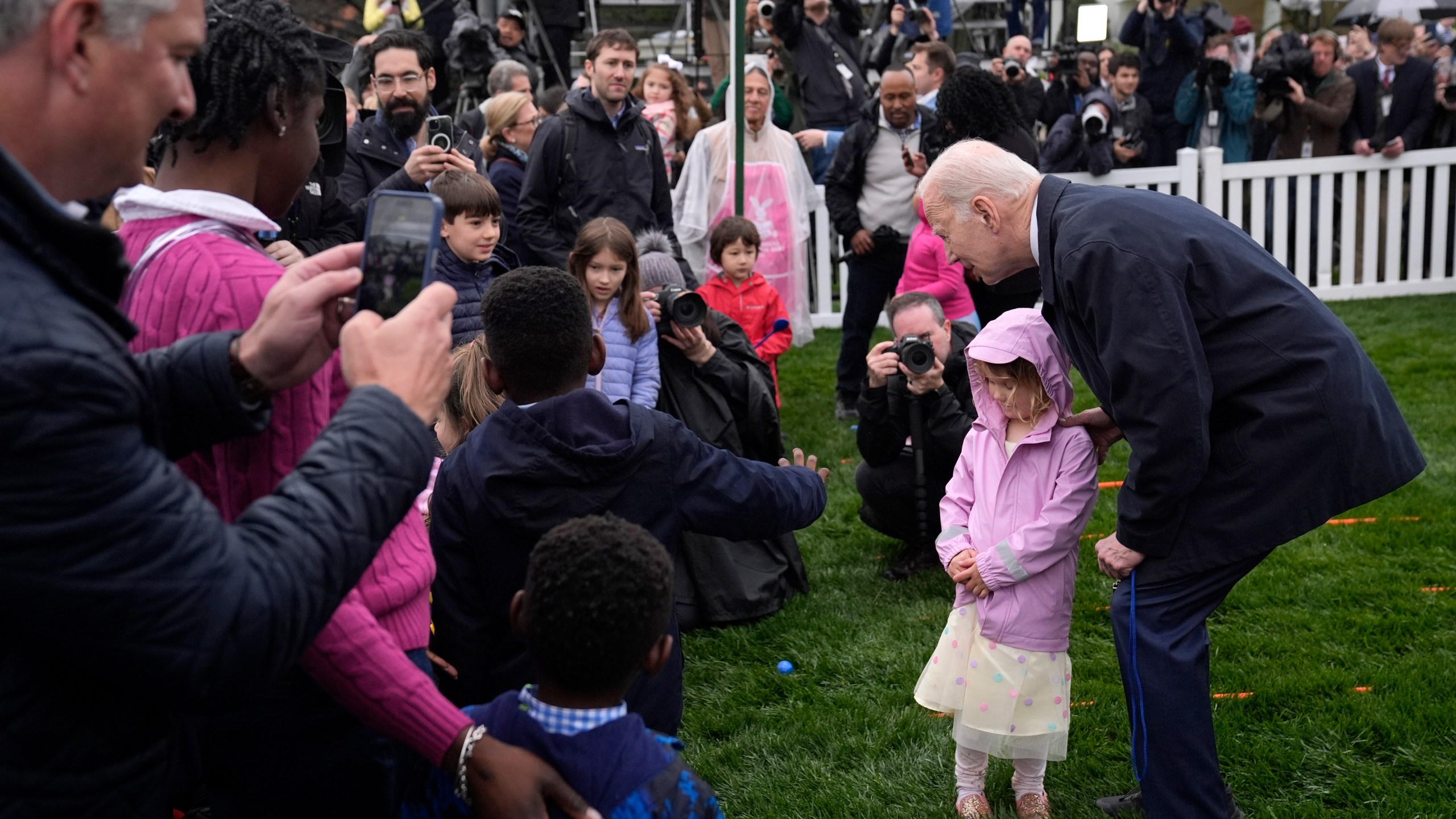 President Joe Biden, right, greets children at the White House Easter Egg Roll on the South Lawn of the White House, Monday, April 1, 2024, in Washington. (AP Photo/Evan Vucci)