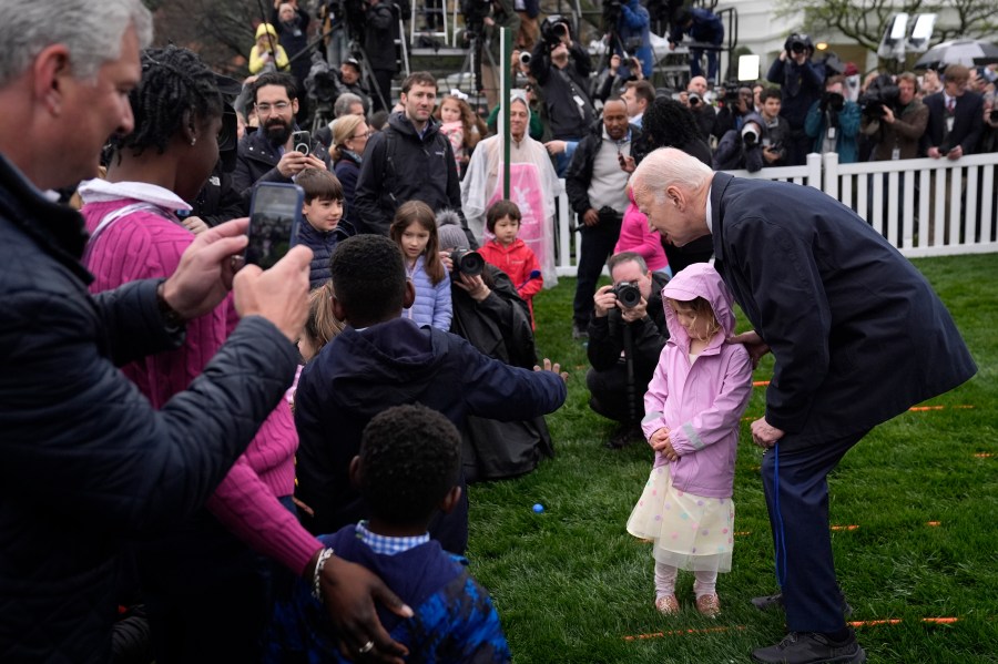 President Joe Biden, right, greets children at the White House Easter Egg Roll on the South Lawn of the White House, Monday, April 1, 2024, in Washington. (AP Photo/Evan Vucci)