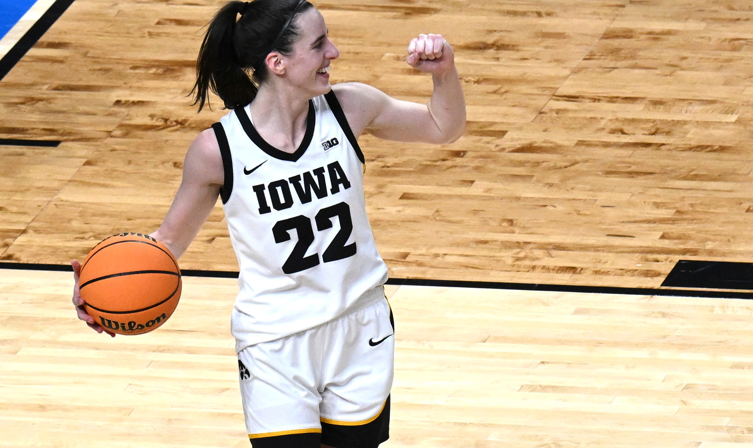 Iowa guard Caitlin Clark (22) reacts after Iowa defeated LSU in an Elite Eight round college basketball game during the NCAA Tournament, Monday, April 1, 2024, in Albany, N.Y. (AP Photo/Hans Pennink)