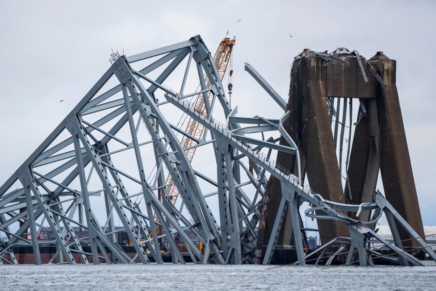 A section of the damaged and collapsed Francis Scott Key Bridge is seen, in the Baltimore port, Monday, April 1, 2024. (Kaitlin Newman/The Baltimore Banner via AP)