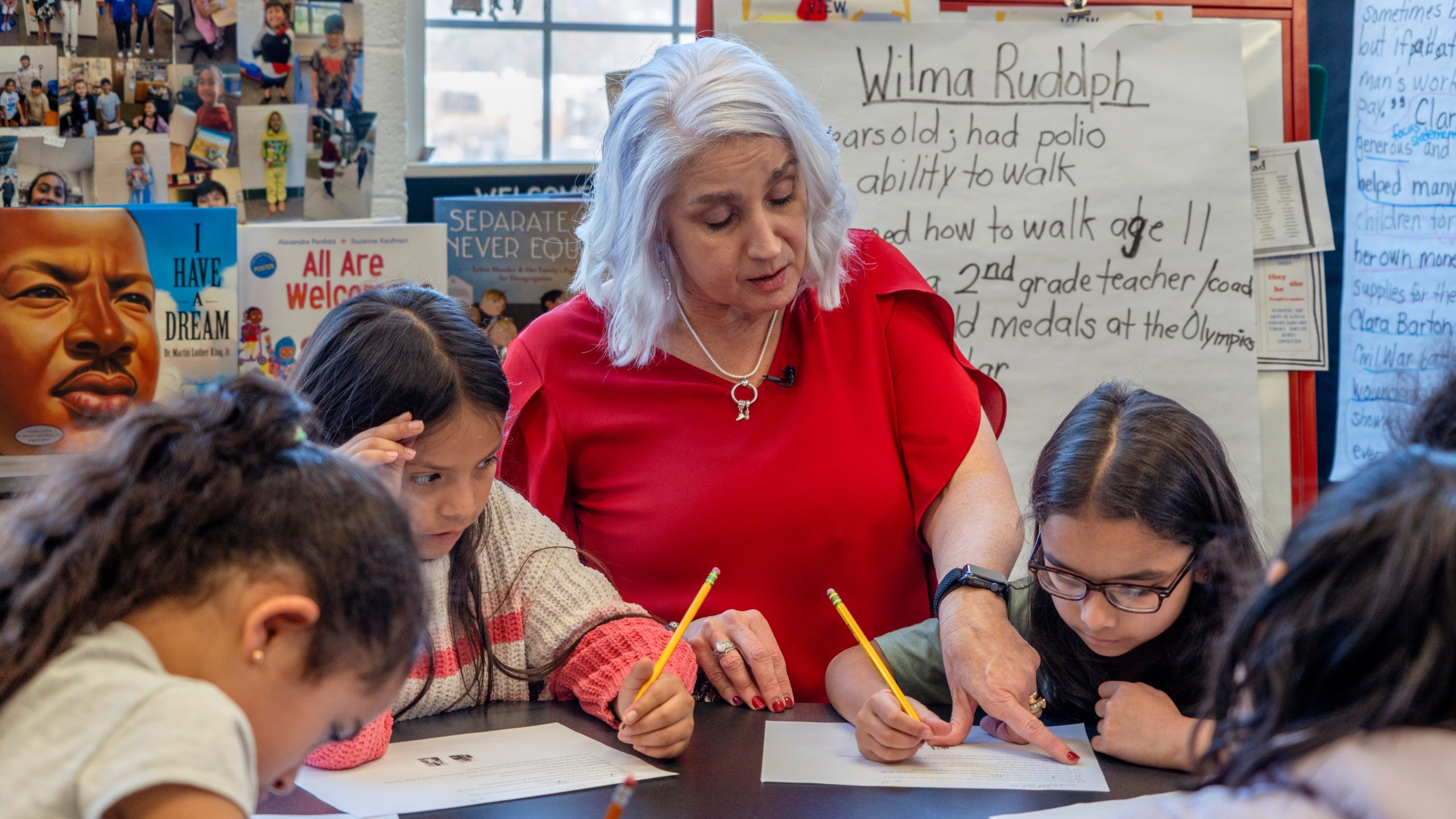 In this photo provided by the Tennessee Department of Education, 2nd grade teacher Missy Testerman, center, who teaches English as a second language, works with students Jana El Kammash, left, Dafne Lozano, and Dwiti Patel, right, at the Rogersville City School, Thursday, March 13, 2024, in Rogersville, Tenn. Testerman has been named the 2024 National Teacher of the Year by the Council of Chief State School Officers. (Tennessee Department of Education via AP)