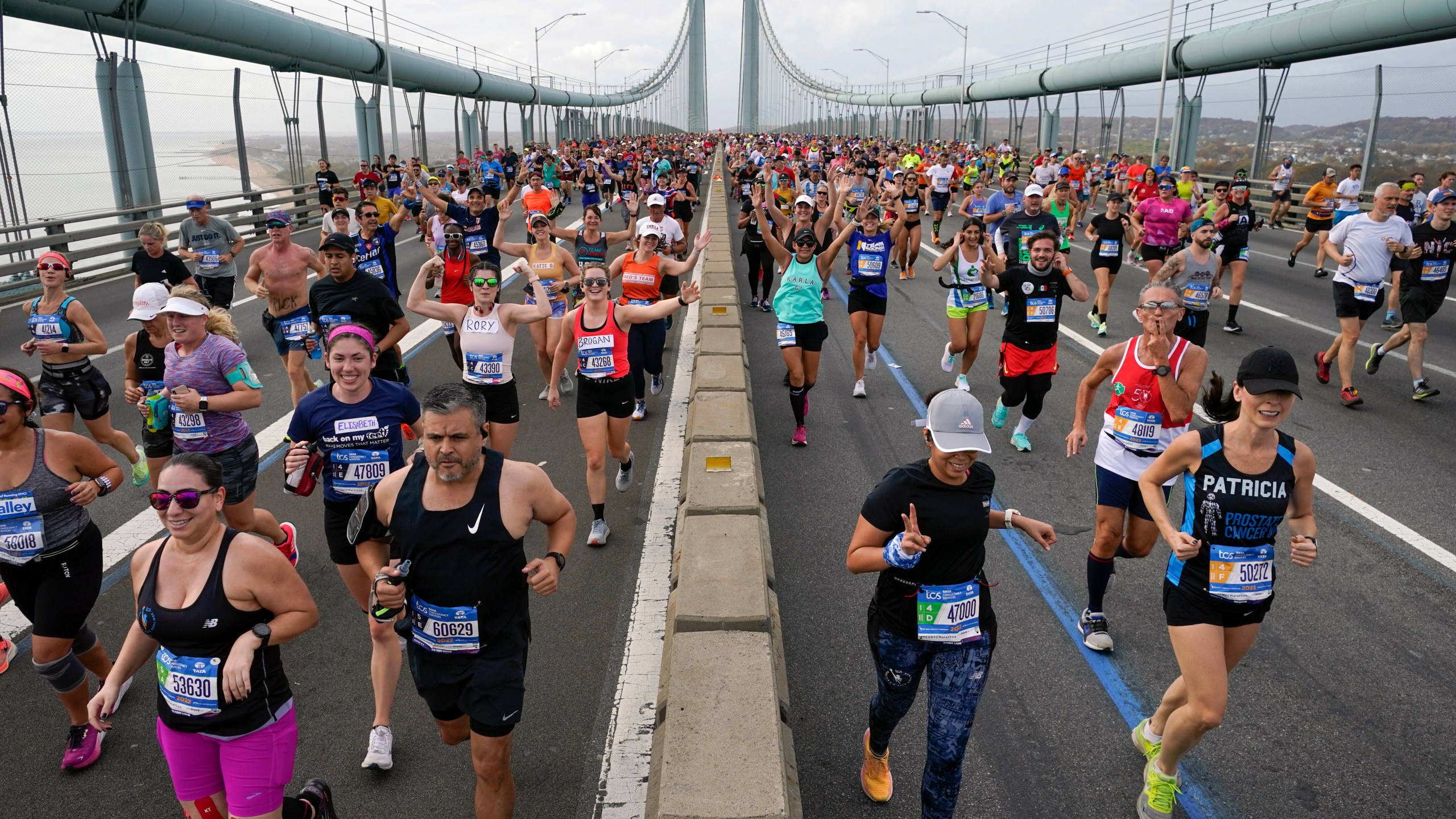 FILE - Runners cross the Verrazzano-Narrows Bridge at the start of the New York City Marathon in New York, Sunday, Nov. 6, 2022. The New York City Marathon organizers will soon have to pay a toll to cross a state bridge, just like every other commuter, if transit officials in New York have their way. The Metropolitan Transportation Authority is demanding the New York Road Runners, organizers of the venerable race held the first Sunday each November, to pay roughly $750,000 for use of the Verrazzano-Narrows Bridge. (AP Photo/Seth Wenig, File)