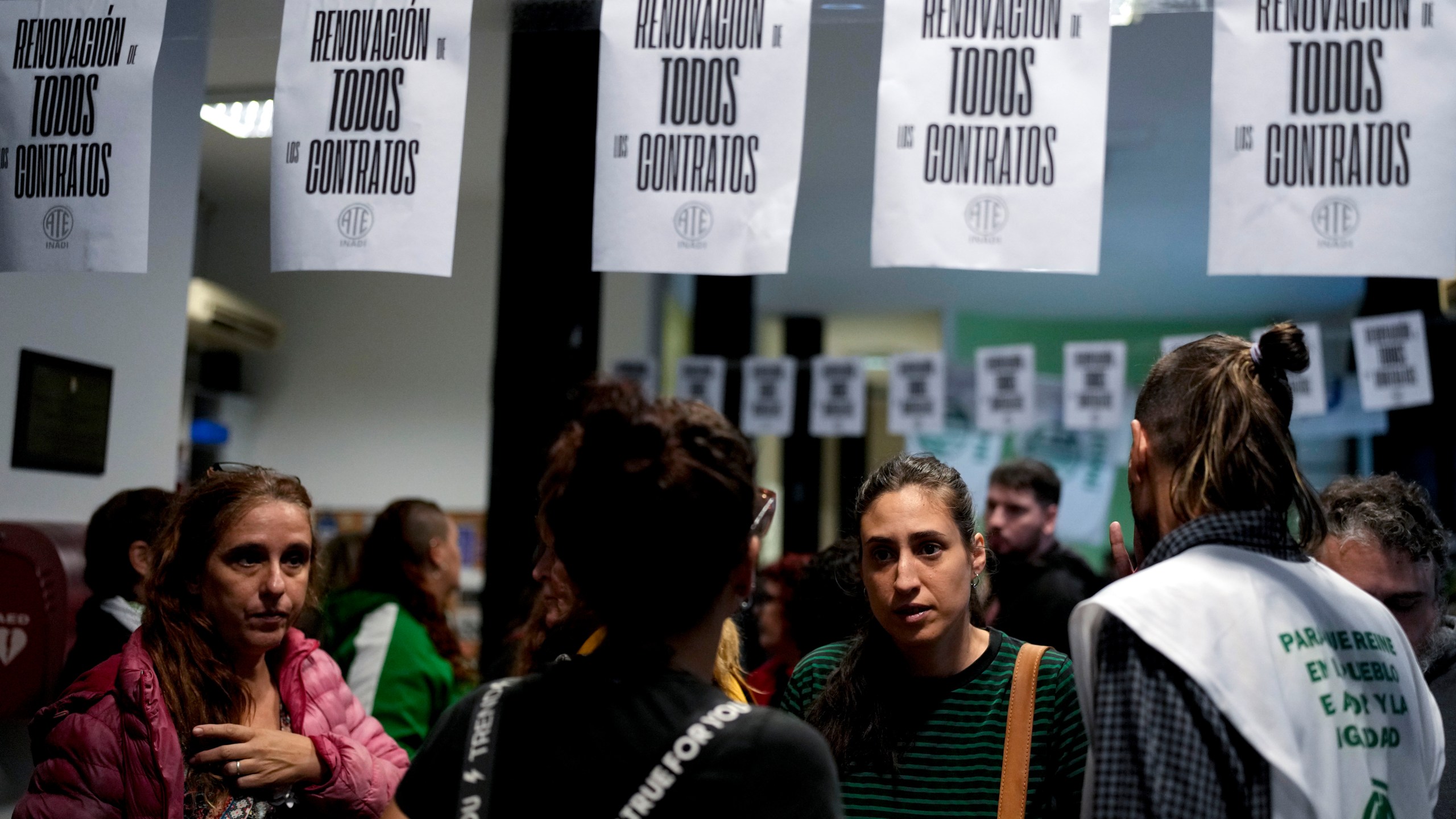 State workers, some who have been laid off, gather inside the National Institute against Discrimination, Xenophobia, and Racism in Buenos Aires, Argentina, Wednesday, April 3, 2024. According to the State Workers Association, more than 11 thousand dismissals of state employees have been carried out by Javier Milei’s government. The union is calling for massive and simultaneous re-entry of dismissed individuals. (AP Photo/Natacha Pisarenko)