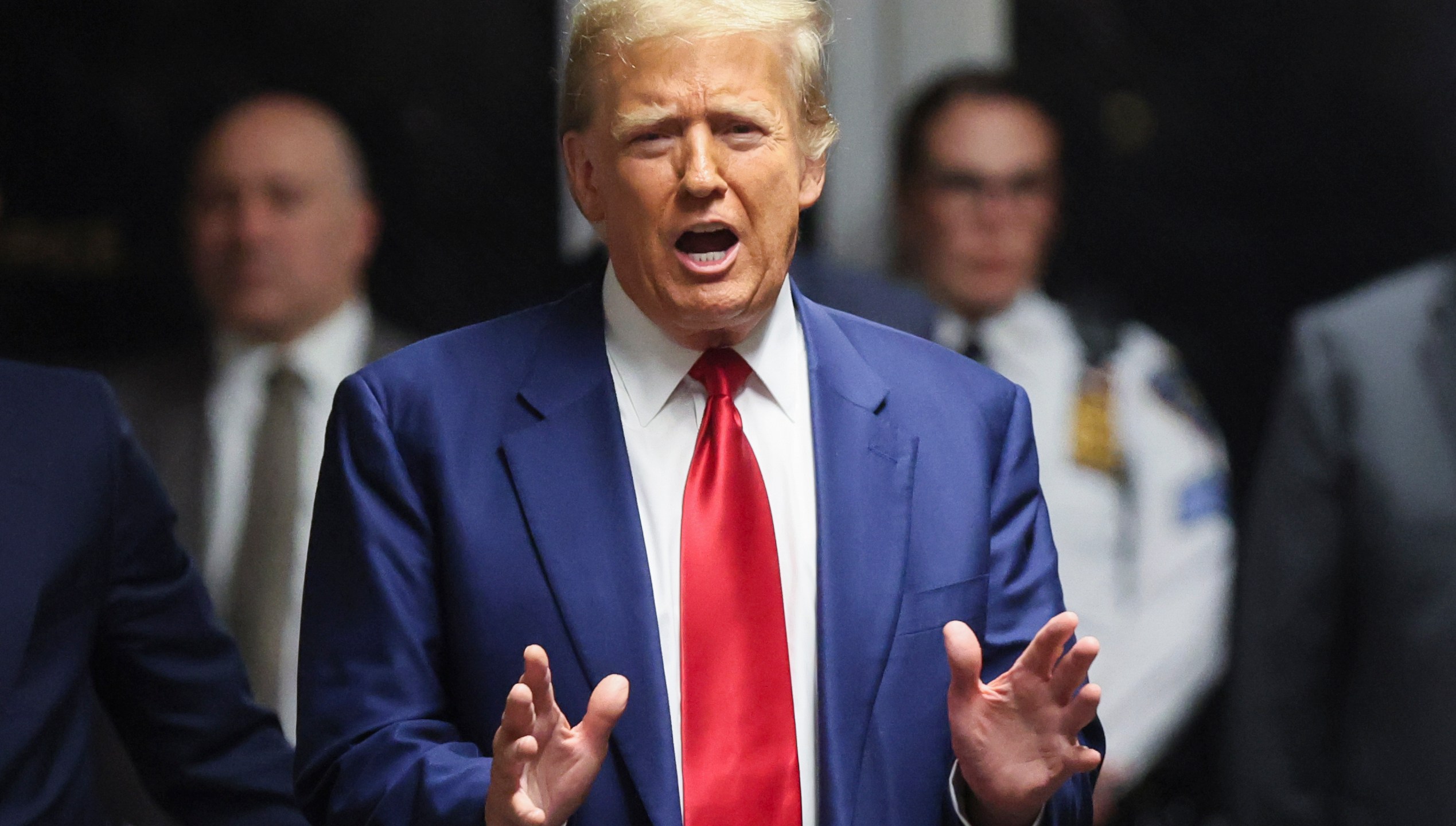 Former President Donald Trump speaks after hearing at New York Criminal Court, Monday, March 25, 2024, in New York. New York Judge Juan M. Merchan has scheduled an April 15 trial date in Trump's hush money case. (Brendan McDermid/Pool Photo via AP)