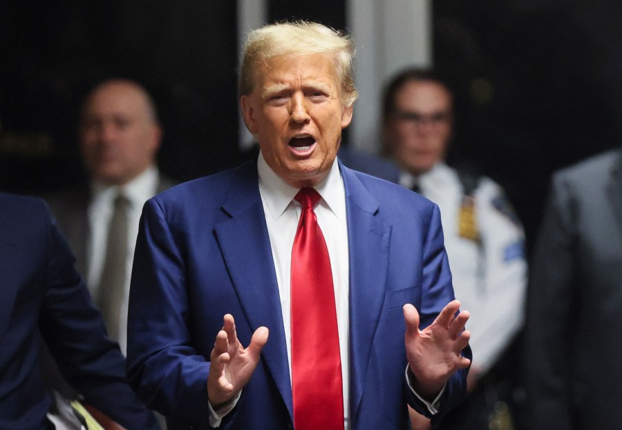 Former President Donald Trump speaks after hearing at New York Criminal Court, Monday, March 25, 2024, in New York. New York Judge Juan M. Merchan has scheduled an April 15 trial date in Trump's hush money case. (Brendan McDermid/Pool Photo via AP)