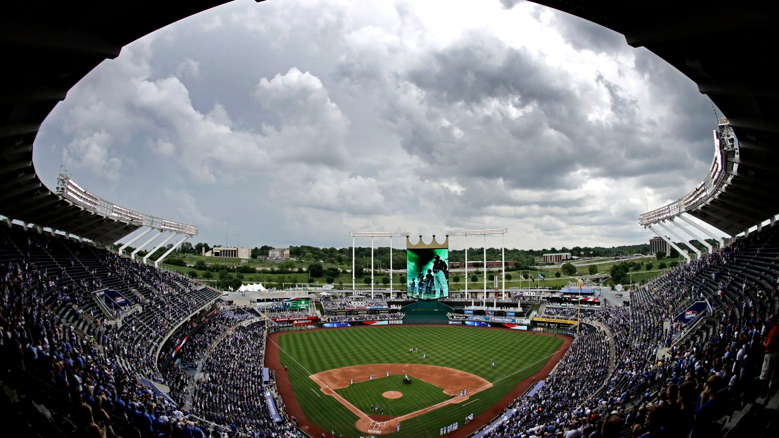 FILE - Clouds gather over Kauffman Stadium before a baseball game between the Kansas City Royals and the Cleveland Indians, Sunday, June 4, 2017, in Kansas City, Mo. Voter rejection of a stadium sales tax plan for the Kansas City Royals and Chiefs has raised questions about what happens next. (AP Photo/Charlie Riedel, File)