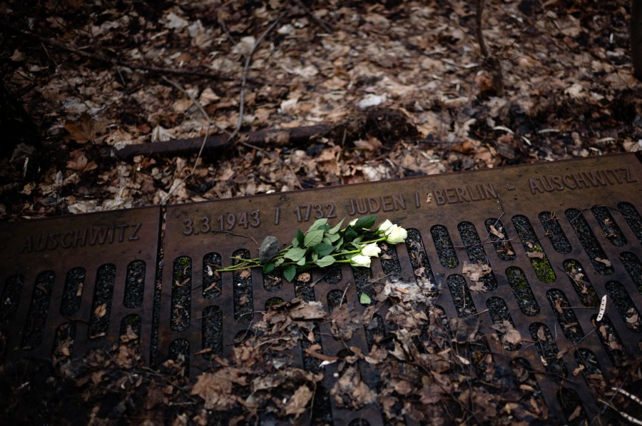 FILE - A white rose is placed at the 'Gleis 17', Track 17, the memorial site for the train transportation from Berlin to the camp, on International Holocaust Remembrance Day in Berlin, Germany, on Jan. 27, 2024. The International Holocaust Remembrance Day marks the anniversary of the liberation of the Nazi death camp Auschwitz - Birkenau on Jan. 27, 1945. (AP Photo/Markus Schreiber, File)