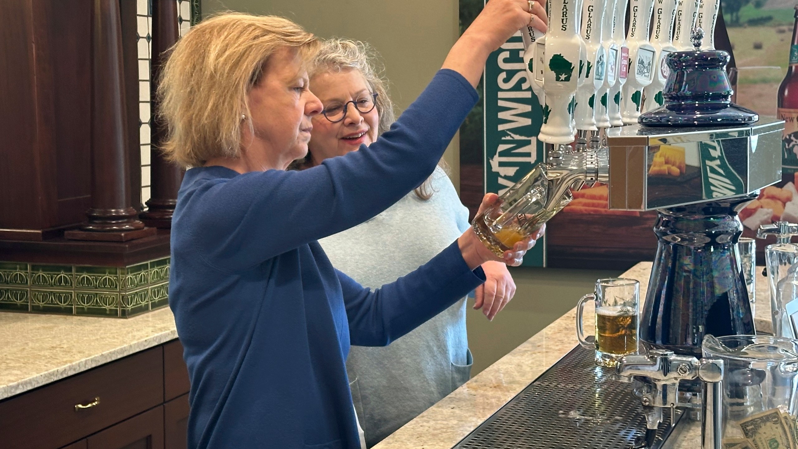 Wisconsin Democratic U.S. Sen. Tammy Baldwin talks to New Glarus Brewing Company co-owner Deb Carey during a campaign stop, Thursday, March 28, 2024, in New Glarus, Wis. The stop was part of her campaign launch tour in a race against Republican Eric Hovde the could determine who has majority control of the Senate. The Wisconsin Senate race between Democratic Sen. Tammy Baldwin and Republican Eric Hovde is setting up as one of the most competitive and expensive Senate races in the country. (AP Photo/Scott Bauer)