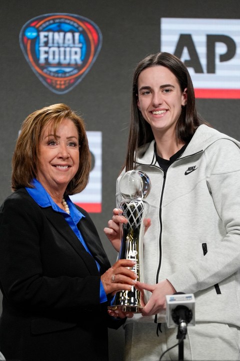 AP's Nancy Nussbaum poses for a photo with Iowa's Caitlin Clark after giving her the AP NCAA Women's Player of the Year award Thursday, April 4, 2024, in Cleveland. (AP Photo/Morry Gash)