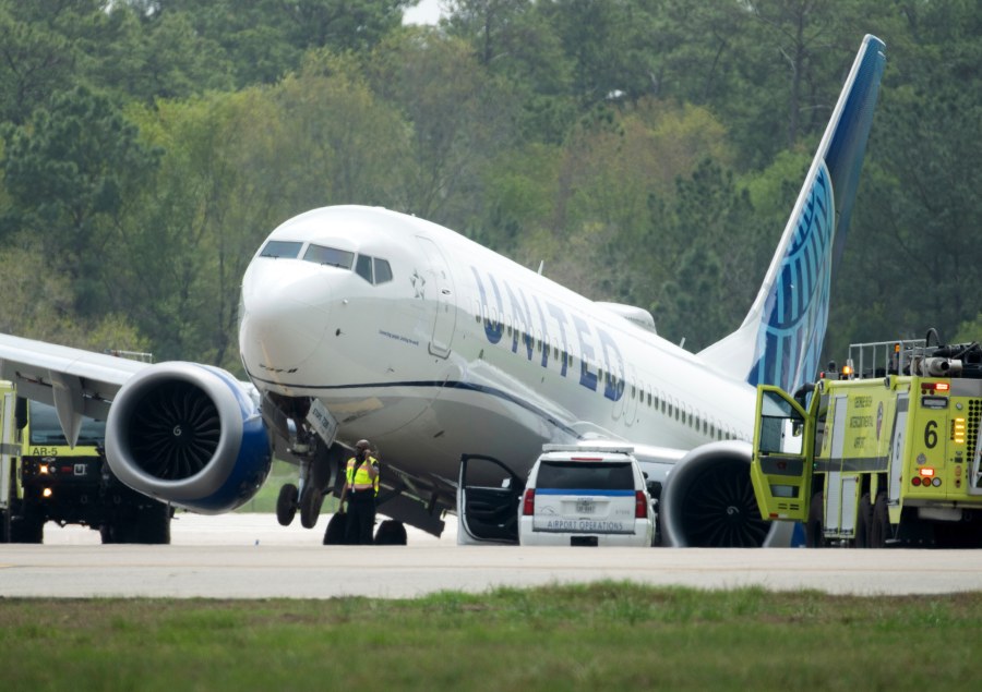 FILE - A United Airlines jet is seen after leaving the taxiway, March 8, 2024, at George Bush Intercontinental Airport in Houston. Federal officials are issuing a preliminary report about the United jet that slid off a taxiway at a Houston airport last month. According to a report, Thursday, April 4, 2024, by the National Transportation Safety Board, the United captain said the brakes seemed less effective than normal. He says the plane and brake pedals shook violently just before the plane slid off the taxiway into a grassy area. (Jason Fochtman/Houston Chronicle via AP, file)