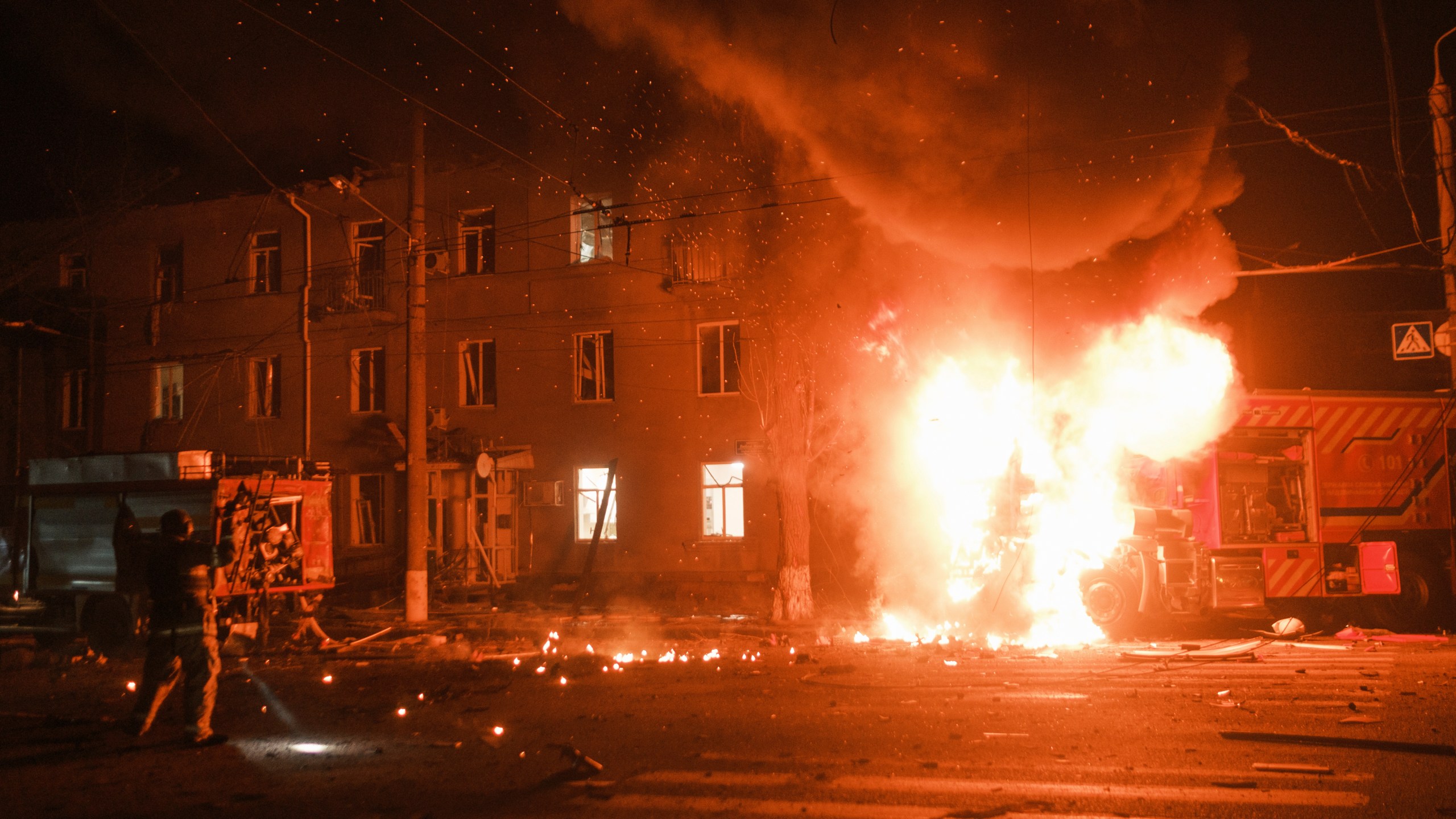 Firefighter's vehicle is seen on fire after Russian drone strikes on residential neighborhood in Kharkiv, Ukraine, on Thursday, April. 4, 2024. (AP Photo/George Ivanchenko)