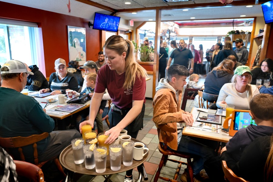 FILE - Waitress Rachel Gurcik serves customers at the Gateway Diner in Westville, Pa. on Oct. 22, 2023. On Friday, April 5, 2024, the U.S. government issues its March jobs report. (Tom Gralish/The Philadelphia Inquirer via AP, File)