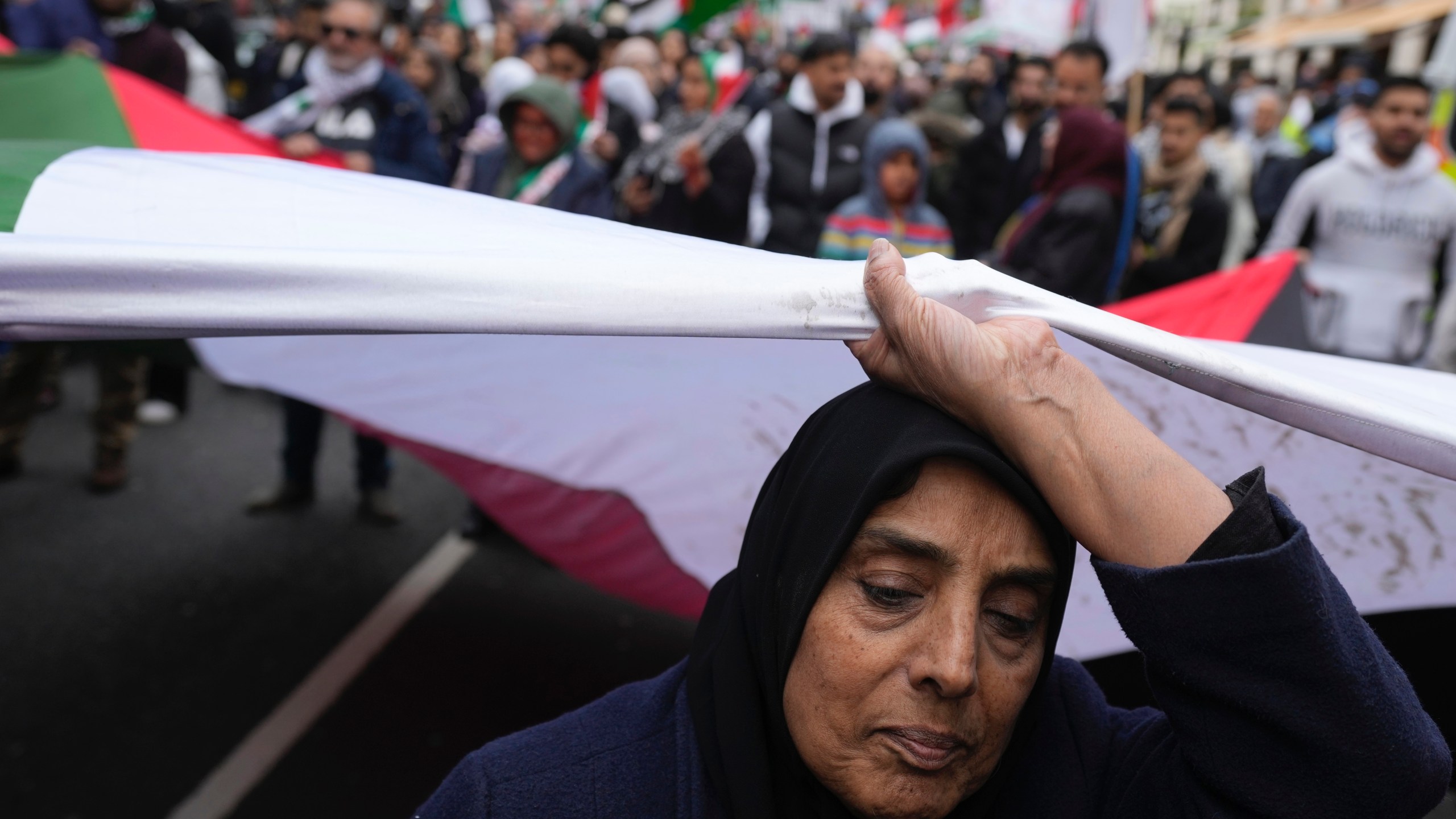 Pro-Palestinian protesters take part at a demonstration on Al Quds Day, in London, Friday, April 5, 2024. Controversial annual demonstration through the capital takes place to show support for the Palestinians. The parade has been called a 'brazen' sign of support for militant group Hezbollah by its opponents, though its supporters argue that critics are trying to suppress their freedom of expression. (AP Photo/Kin Cheung)