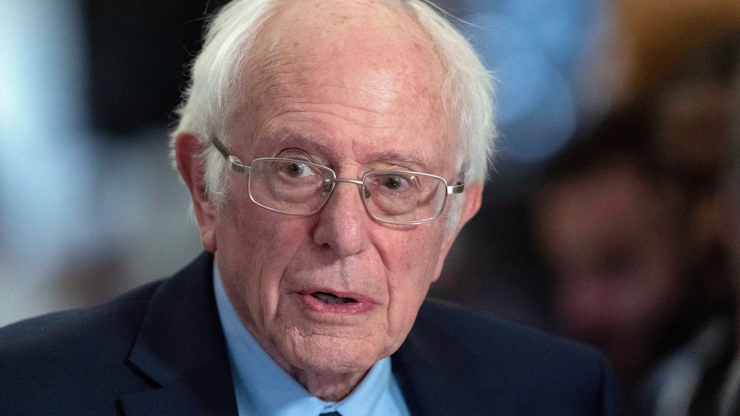 FILE - Sen. Bernie Sanders, I-Vt., talks to the media as he walks to the House chamber before President Joe Biden's State of the Union address at the U.S. Capitol Thursday, March 7, 2024, in Washington. Police in Vermont are seeking a suspect who allegedly started a fire Friday, April 5, 2024, outside the office of U.S. Sen. Bernie Sanders. The small blaze caused minor damage but no injuries. (AP Photo/Jose Luis Magana, File)