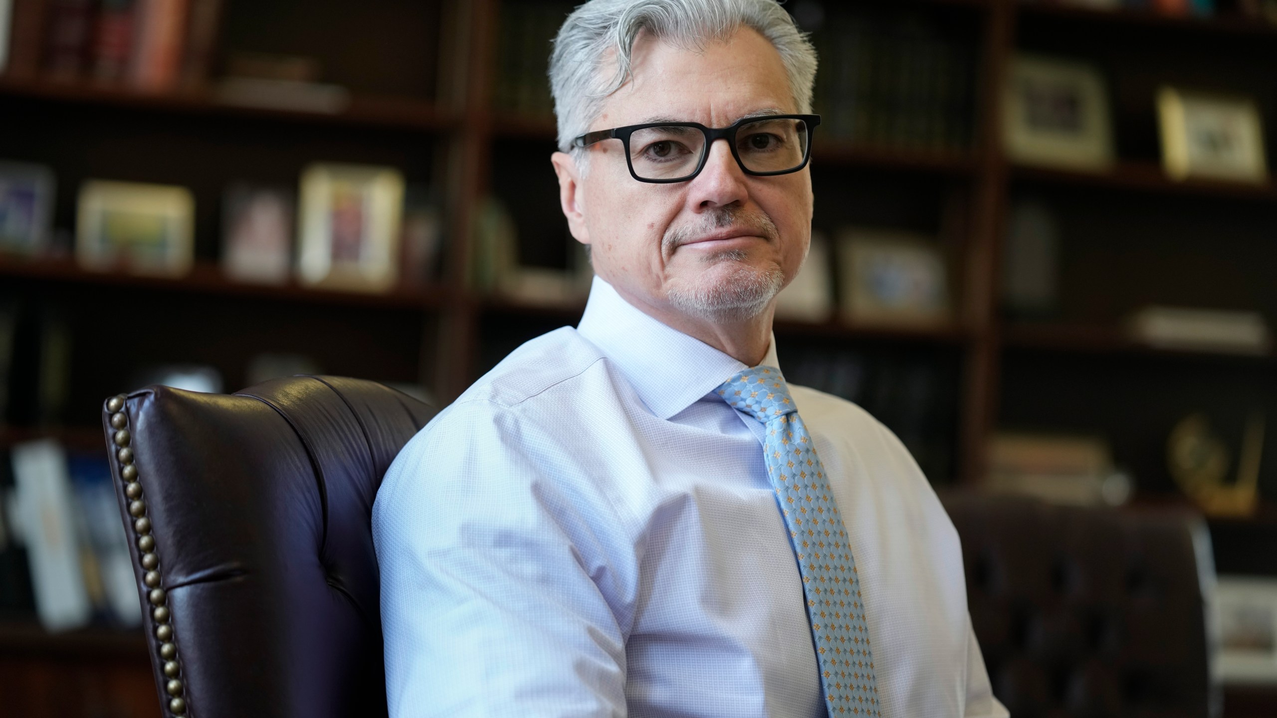 FILE - Judge Juan M. Merchan poses in his chambers in New York, Thursday, March 14, 2024. Former President Donald Trump is demanding a new judge just days before his hush-money criminal trial is set to begin, rehashing longstanding grievances with Merchan, the current judge, in a long-shot, eleventh-hour bid to disrupt and delay the case. (AP Photo/Seth Wenig)