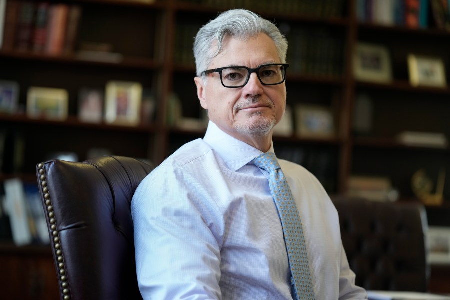 FILE - Judge Juan M. Merchan poses in his chambers in New York, Thursday, March 14, 2024. Former President Donald Trump is demanding a new judge just days before his hush-money criminal trial is set to begin, rehashing longstanding grievances with Merchan, the current judge, in a long-shot, eleventh-hour bid to disrupt and delay the case. (AP Photo/Seth Wenig)