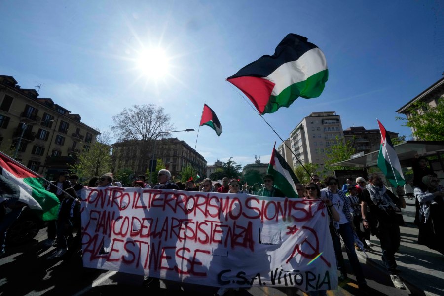 Demonstrators participate in a solidarity rally for Palestinians in Gaza, in Milan, Italy, Saturday, April 6, 2024. (AP Photo/Luca Bruno)