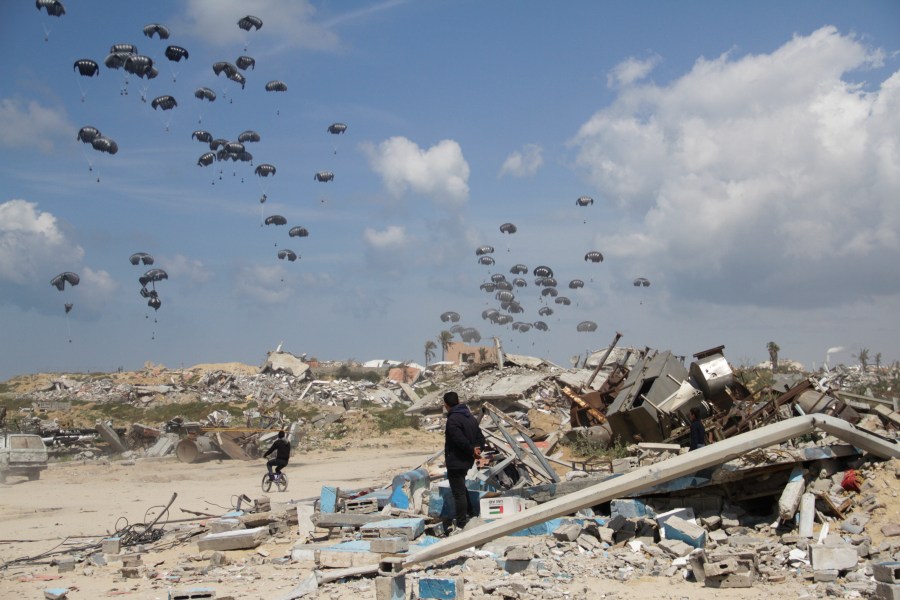 Humanitarian aid is airdropped to Palestinians over Gaza City, Gaza Strip, Monday, March 25, 2024. (AP Photo/Mahmoud Essa)