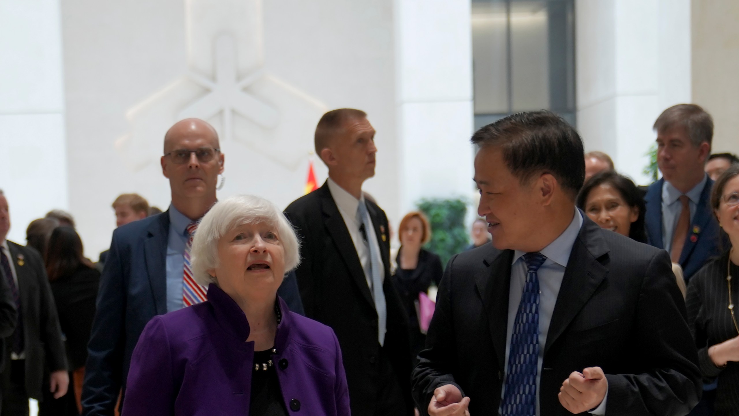 U.S. Treasury Secretary Janet Yellen, left, walks with Governor of the People's Bank of China Pan Gongsheng as they meet at the People's Bank of China in Beijing Monday, April 8, 2024. (AP Photo/Tatan Syuflana, Pool)