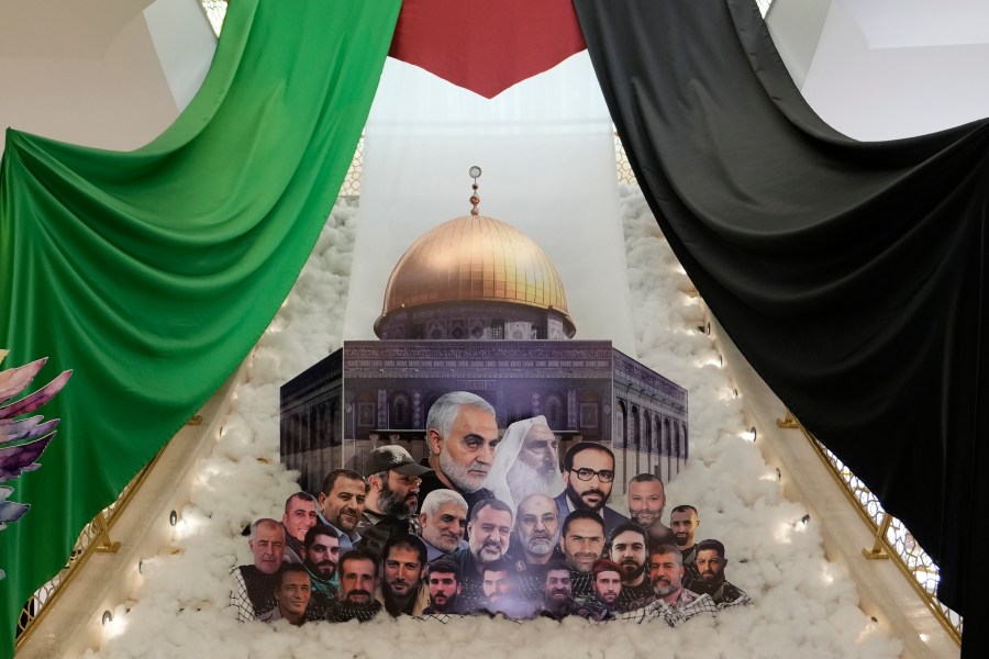 A display showing slain Iranian military officials and allied Lebanese and Palestinians next to the al-Aqsa Mosque is set up, as the Iranian embassy receives condolences for the death of Iranian Revolutionary Guard Gen. Mohammad Reza Zahedi, who led the Iranian Revolutionary Guard's Quds Force in Lebanon and Syria until 2016, and six other Iranian military officials, in Beirut, Lebanon, Monday, April 8, 2024. An Israeli airstrike that demolished Iran's consulate in Syria on last Monday killed two Iranian generals and five officers, according to Iranian officials. The strike appeared to signify an escalation of Israel's targeting of military officials from Iran, which supports militant groups fighting Israel in Gaza, and along its border with Lebanon. (AP Photo/Hassan Ammar)