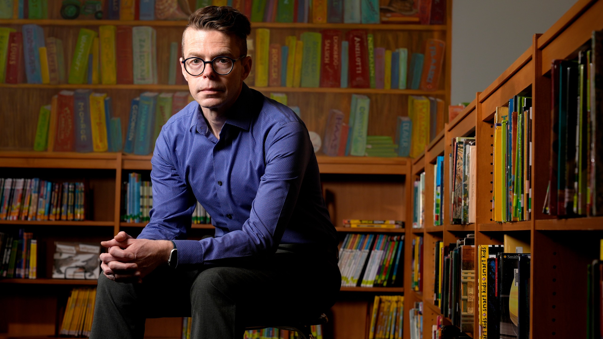 Tom Bober, librarian and President of the Missouri Association of School Librarians, poses for a photo Wednesday, March 20, 2024, in Clayton, Mo. (AP Photo/Jeff Roberson)