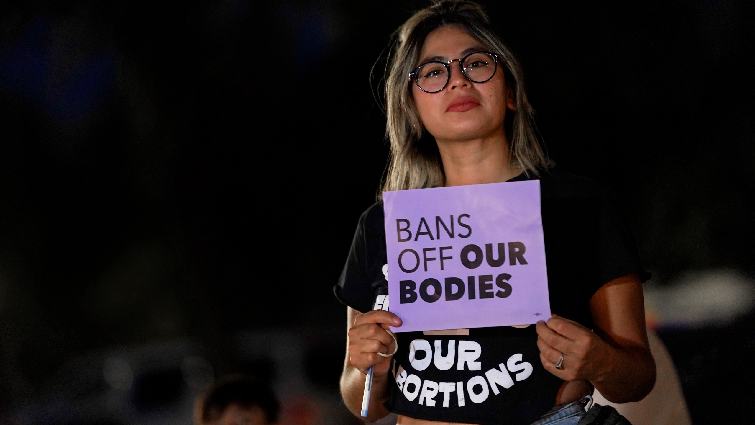 FILE - This file photo shows Celina Washburn at a protest on Sept. 23, 2022, outside the Arizona Capitol in Phoenix to voice her opposition to an abortion ruling. The Arizona Supreme Court ruled Tuesday, April 9, 2024, that the state can enforce its long-dormant law criminalizing all abortions except when a mother’s life is at stake. (AP Photo/Matt York, File)