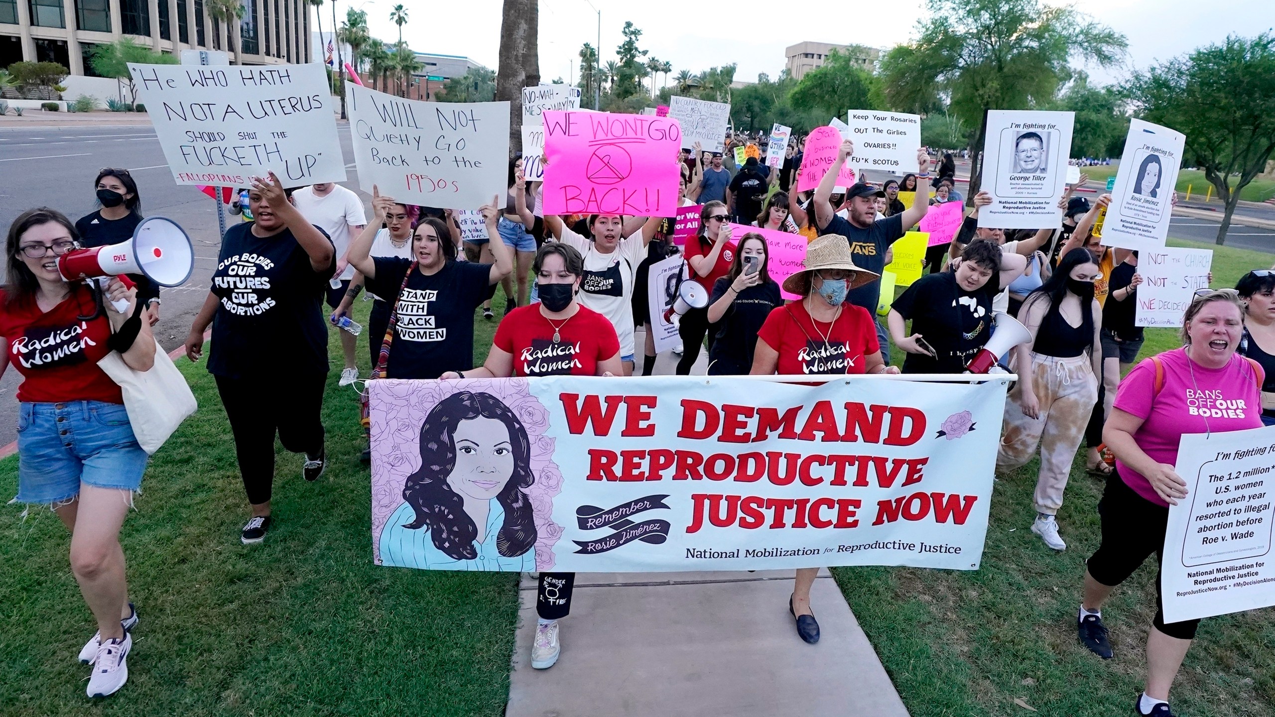 FILE - Thousands of protesters march around the Arizona Capitol in protest after the Supreme Court decision to overturn the landmark Roe v. Wade abortion decision Friday, June 24, 2022, in Phoenix. An Arizona Supreme Court ruling, Tuesday, April 9, 2024, allowing enforcement of an abortion ban is the latest action to elevate abortion as a key political issue this year. (AP Photo/Ross D. Franklin, File)