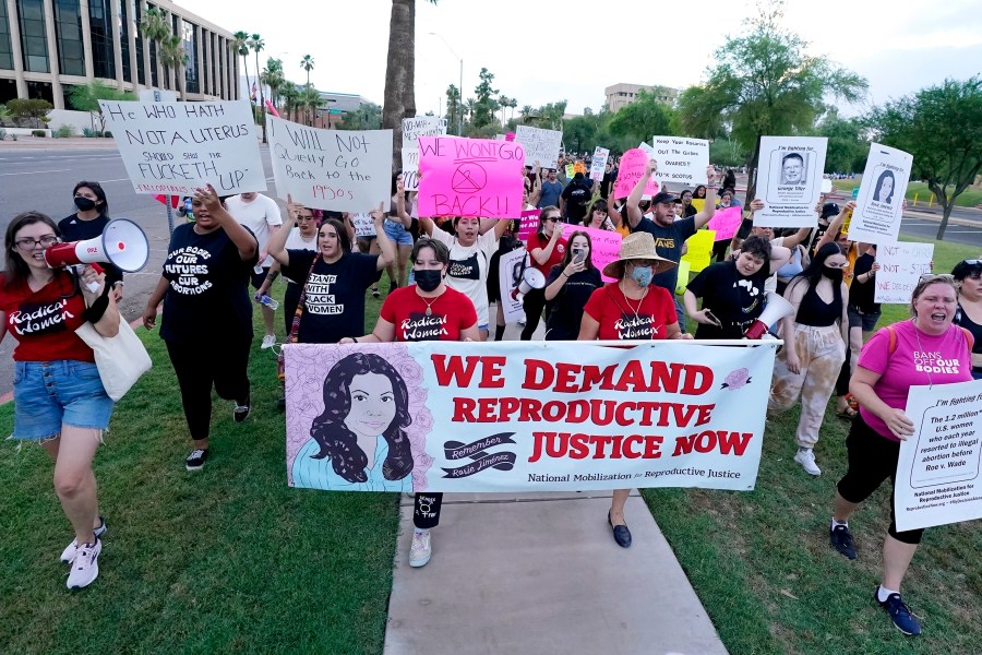 FILE - Thousands of protesters march around the Arizona Capitol in protest after the Supreme Court decision to overturn the landmark Roe v. Wade abortion decision Friday, June 24, 2022, in Phoenix. An Arizona Supreme Court ruling, Tuesday, April 9, 2024, allowing enforcement of an abortion ban is the latest action to elevate abortion as a key political issue this year. (AP Photo/Ross D. Franklin, File)