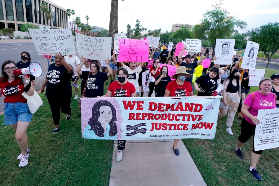 FILE - Thousands of protesters march around the Arizona Capitol in protest after the Supreme Court decision to overturn the landmark Roe v. Wade abortion decision Friday, June 24, 2022, in Phoenix. A stunning abortion ruling this week in April 2024, has supercharged Arizona’s role in the looming fall election. (AP Photo/Ross D. Franklin, File)