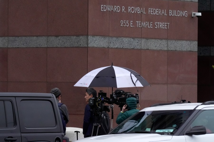 A news crew waits outside federal court for Ippei Mizuhara, the former longtime interpreter for Los Angeles Dodgers star Shohei Ohtani, Friday, April 12, 2024, in Los Angeles. Mizuhara is charged with federal bank fraud, alleging that he stole more than $16 million from the Japanese sensation to cover gambling bets and debts, federal authorities said. (AP Photo/Damian Dovarganes)