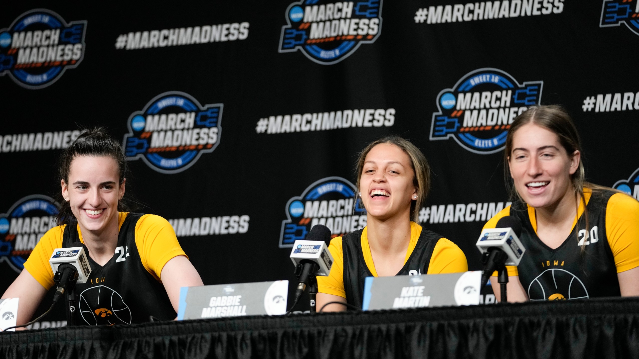 Iowa guard Catlin Clark, left, guard Gabbie Marshall, center and guard Kate Martin speak to reporters during a news conference at the women's college basketball NCAA Tournament in Albany, N.Y., Friday, March 29, 2024. (AP Photo/Mary Altaffer)