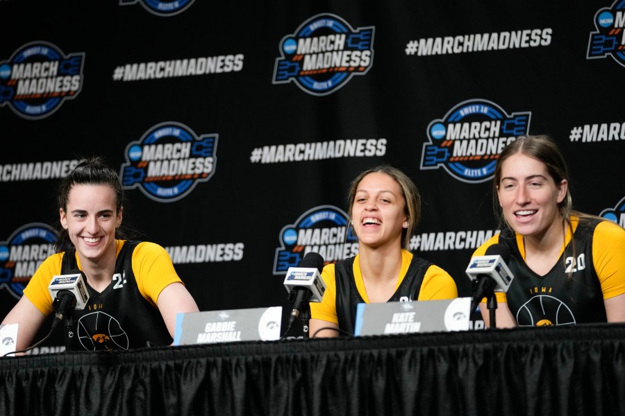 Iowa guard Catlin Clark, left, guard Gabbie Marshall, center and guard Kate Martin speak to reporters during a news conference at the women's college basketball NCAA Tournament in Albany, N.Y., Friday, March 29, 2024. (AP Photo/Mary Altaffer)