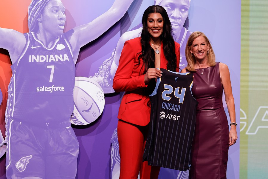 South Carolina's Kamilla Cardoso, left, poses for a photo with WNBA commissioner Cathy Engelbert after being selected third overall by the Chicago Sky during the first round of the WNBA basketball draft, Monday, April 15, 2024, in New York. (AP Photo/Adam Hunger)