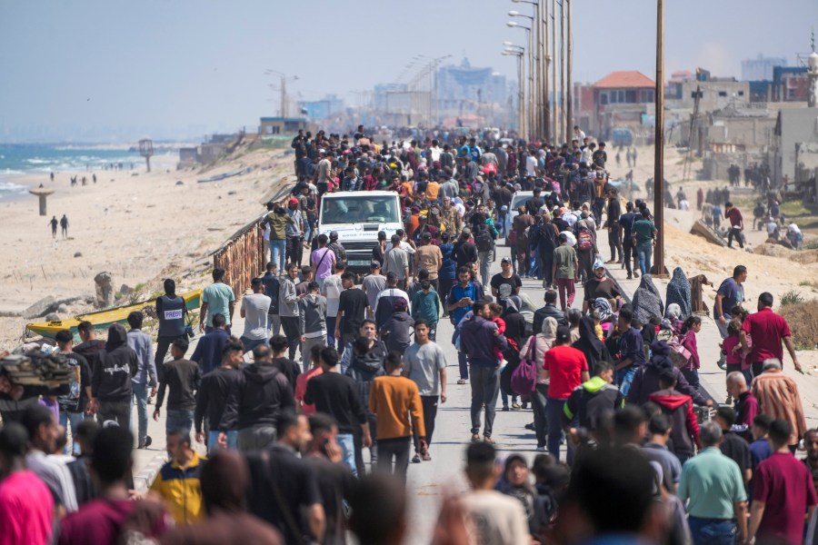 Displaced Palestinians trying to walk back from central Gaza Strip to northern Gaza Strip , Sunday, April 14, 2024. (AP Photo/Abdel Kareem Hana)