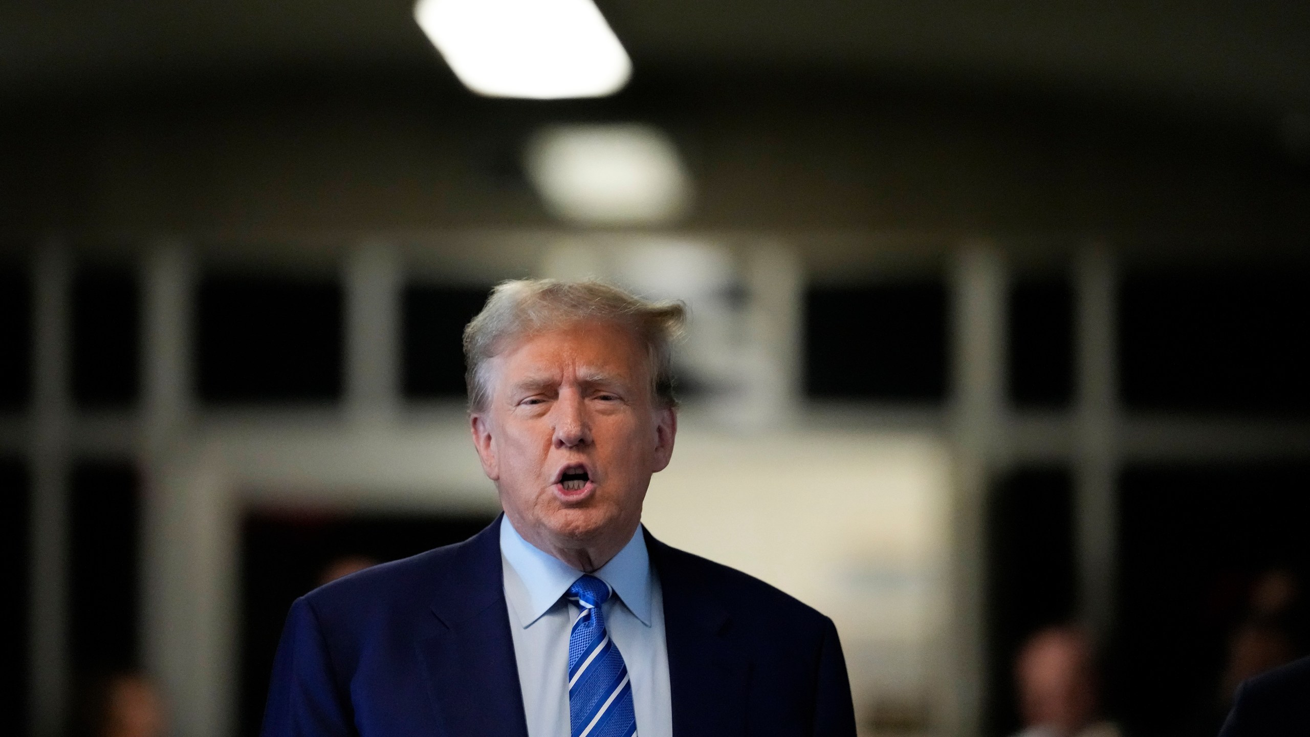 Former President Donald Trump speaks before entering the courtroom at Manhattan criminal court, Tuesday, April 16, 2024, in New York. Donald Trump returned to the courtroom Tuesday as a judge works to find a panel of jurors who will decide whether the former president is guilty of criminal charges alleging he falsified business records to cover up a sex scandal during the 2016 campaign. (AP Photo/Mary Altaffer)