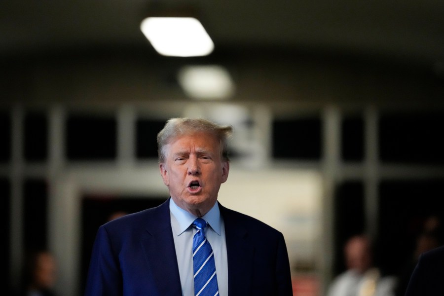 Former President Donald Trump speaks before entering the courtroom at Manhattan criminal court, Tuesday, April 16, 2024, in New York. Donald Trump returned to the courtroom Tuesday as a judge works to find a panel of jurors who will decide whether the former president is guilty of criminal charges alleging he falsified business records to cover up a sex scandal during the 2016 campaign. (AP Photo/Mary Altaffer)