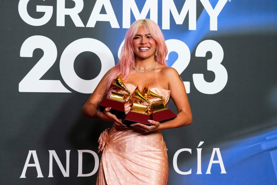 Karol G poses with the awards for best urban album for "Mañana Sera Bonito", for album of the year for "Mañana Sera Bonito" and the award for best urban fusion/performance for "TQG" during the 24th annual Latin Grammy Awards in Seville, Spain, Thursday, Nov. 16, 2023. The 2024 Latin Grammys will return to Miami — where the show first started 25 years ago, and where the organization is headquartered. (Photo by Jose Breton/Invision/AP, File)