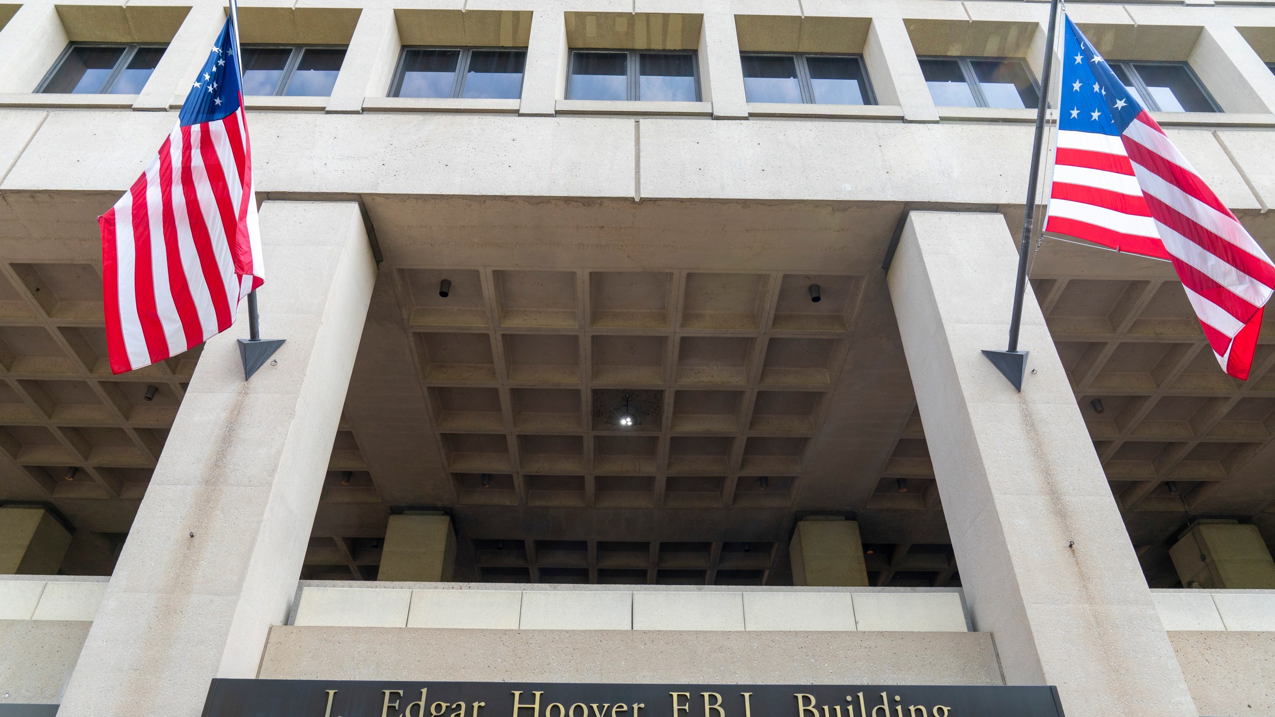 FILE - The J. Edgar Hoover FBI Building is seen June 9, 2023, in Washington. The Justice Department is ramping up its efforts to reduce violent crime in the U.S., launching a specialized gun intelligence center in Chicago and expanding task forces to curb carjackings. (AP Photo/Alex Brandon, File)