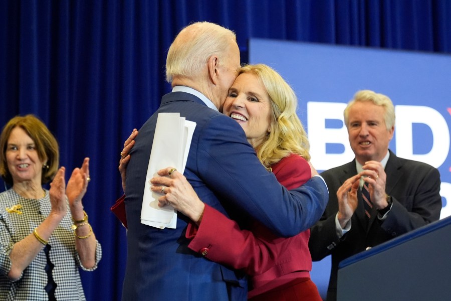 Kerry Kennedy, right, hugs President Joe Biden at a campaign event, Thursday, April 18, 2024, in Philadelphia. Pictured from left are members of the Kennedy family Kathleen Kennedy Townsend and Christopher Kennedy. (AP Photo/Alex Brandon)