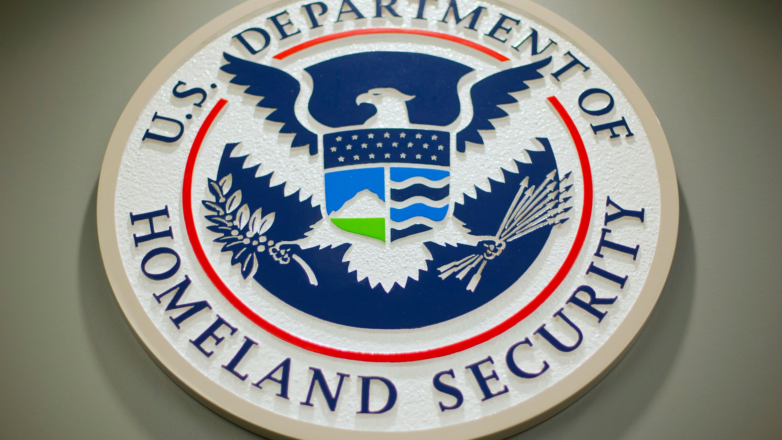 FILE - The Department of Homeland Security logo is seen during a news conference in Washington, Feb. 25, 2015. The Biden administration says it has sent about 50 Haitians back to their country, marking its first deportation flight in months to the Caribbean nation struggling under surging gang violence. Authorities didn’t offer details of flight, Thursday, April 18, 2024, beyond how many deported Haitians were aboard. The Homeland Security Department said it will continue to enforce U.S. laws and immigration policy throughout the Caribbean, as well as at the southern border. (AP Photo/Pablo Martinez Monsivais, File)