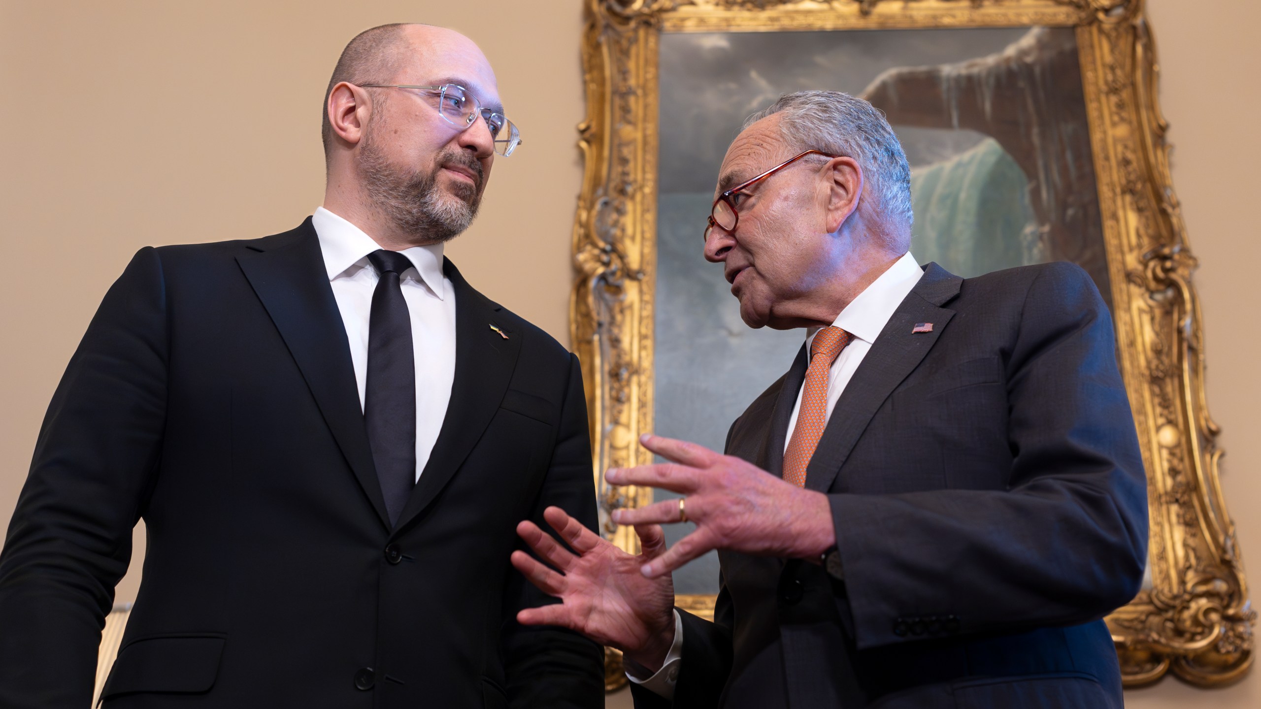 Ukraine's Prime Minister Denys Shmyhal, left, is welcomed by Senate Majority Leader Chuck Schumer, D-N.Y., as Congress moves to advance an emergency aid package for Israel, Ukraine and Taiwan, at the Capitol in Washington, Thursday, April 18, 2024. (AP Photo/J. Scott Applewhite)