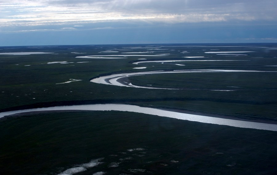 This July 8, 2004, photo provided by the United States Geological Survey shows Fish Creek through the National Petroleum Reserve-Alaska, managed by the Bureau of Land Management on Alaska's North Slope. (David W. Houseknecht/United States Geological Survey via AP)