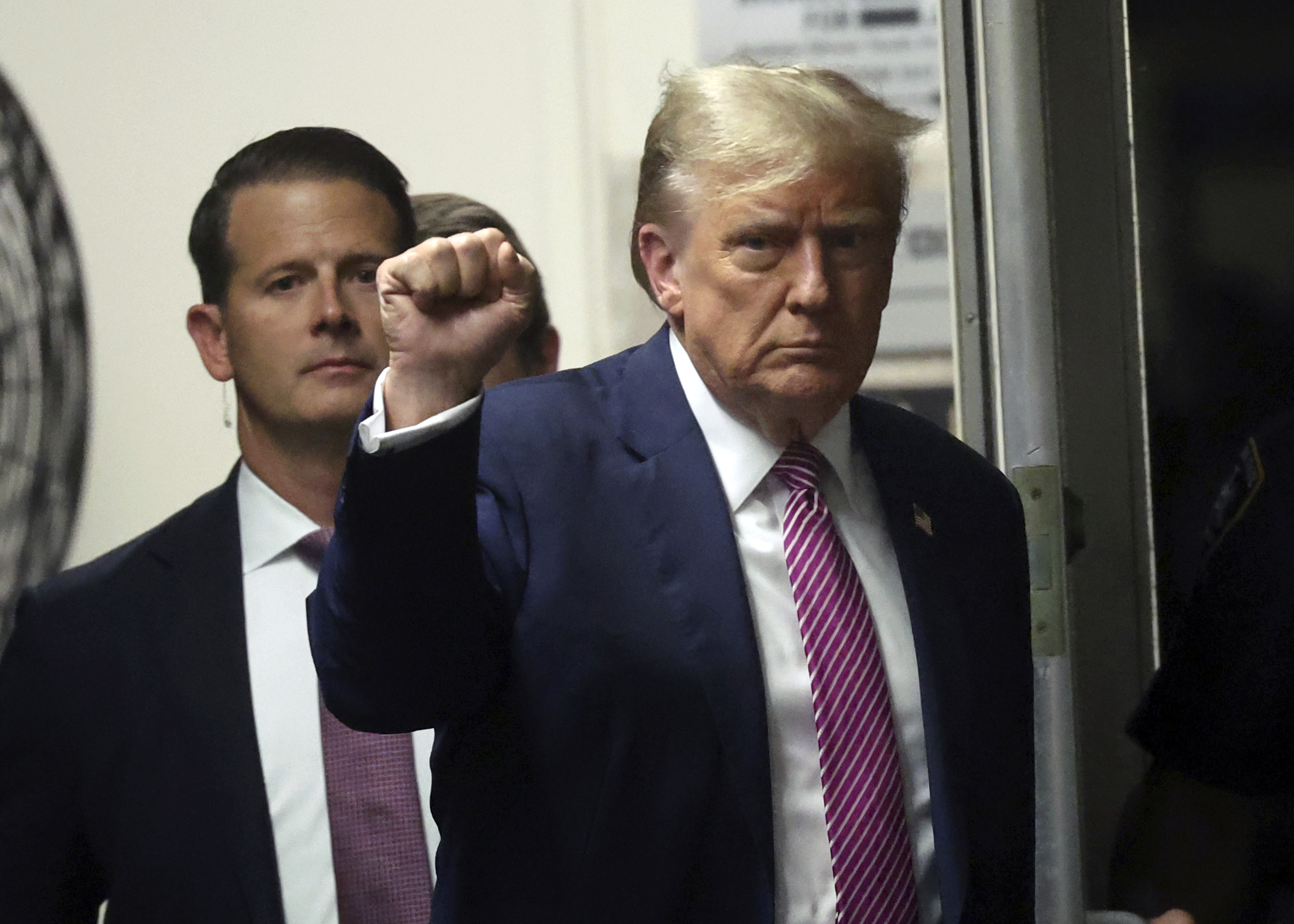 Former President Donald Trump gestures as he returns to the courtroom following a lunch break in his trial, Friday, April 19, 2024, at Manhattan Criminal Court in New York. (Spencer Platt/Pool Photo via AP)