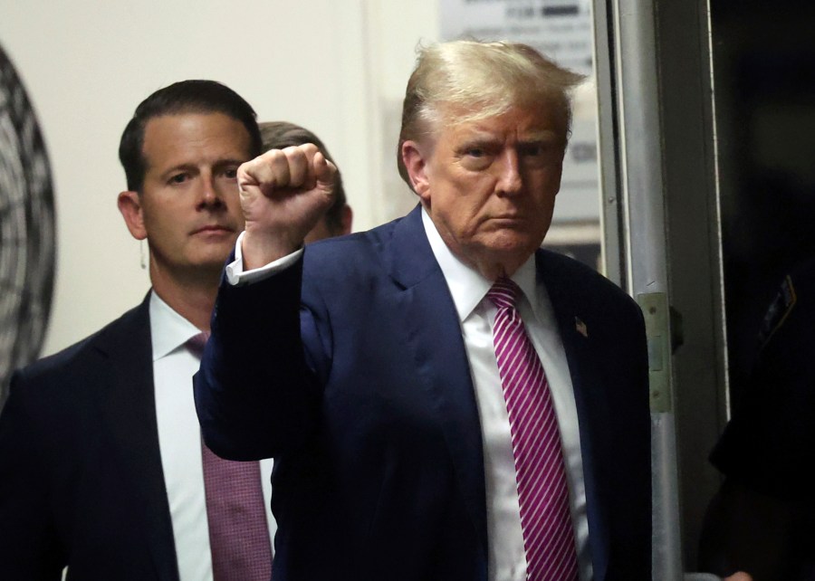 Former President Donald Trump gestures as he returns to the courtroom following a lunch break in his trial, Friday, April 19, 2024, at Manhattan Criminal Court in New York. (Spencer Platt/Pool Photo via AP)