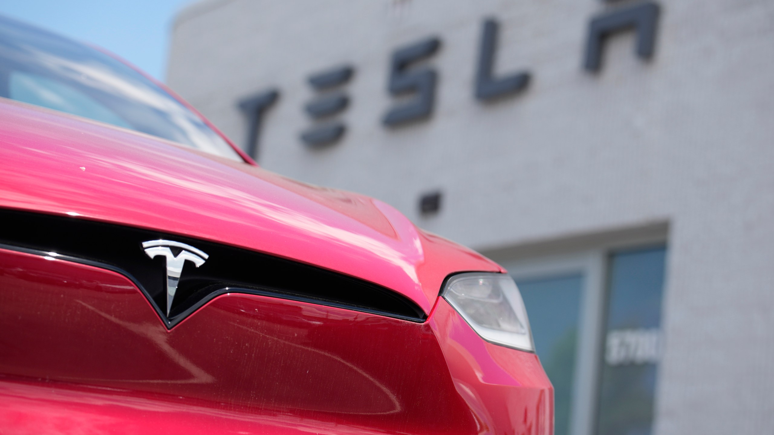 FILE - A Model X sports-utility vehicle sits outside a Tesla store in Littleton, Colo., on June 18, 2023. On Friday, April 19, 2024, Tesla knocked $2,000 off the prices of three of its five models in the United States. (AP Photo/David Zalubowski, File)