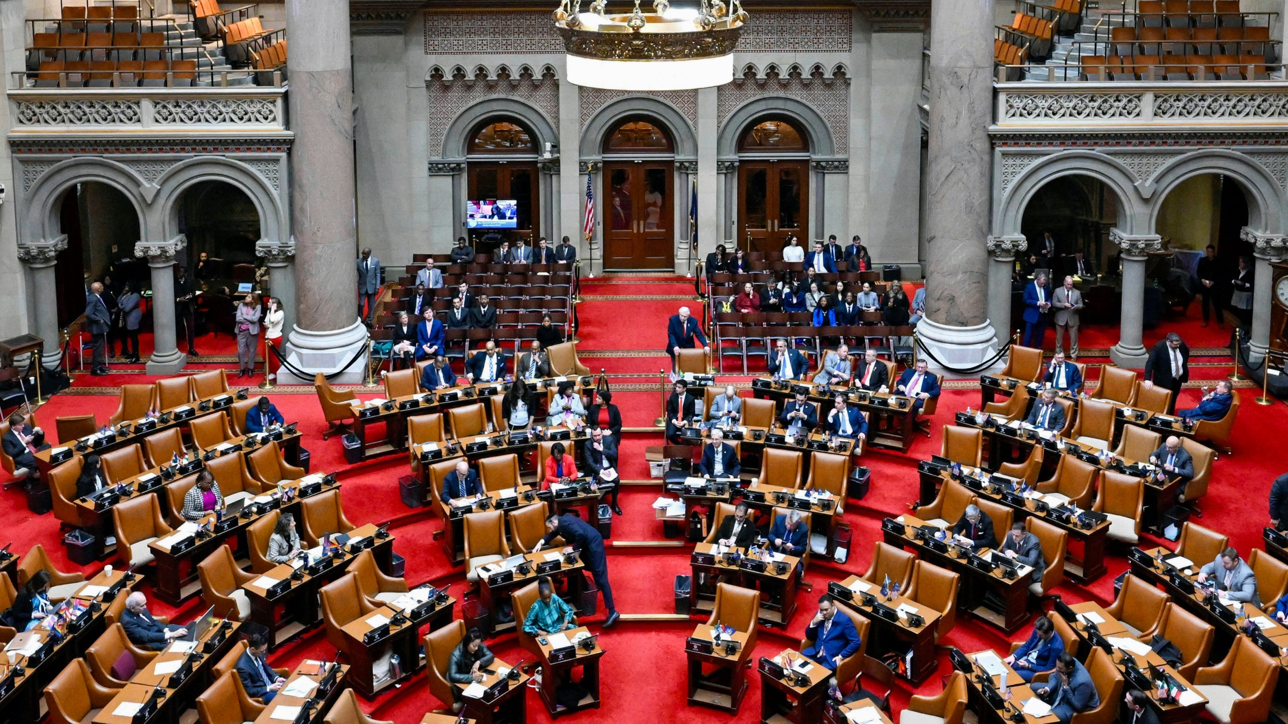 FILE - The New York state Assembly Chamber is seen during a legislative session after Gov. Kathy Hochul presented her 2025 executive state budget at the state Capitol, Jan. 16, 2024, in Albany, N.Y. New York lawmakers passed a $237 billion state budget Saturday, April 20, that includes plans to spur housing construction and combat unlicensed marijuana stores. (AP Photo/Hans Pennink, File)