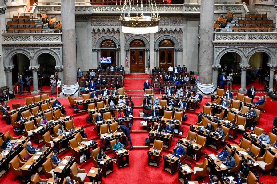 FILE - The New York state Assembly Chamber is seen during a legislative session after Gov. Kathy Hochul presented her 2025 executive state budget at the state Capitol, Jan. 16, 2024, in Albany, N.Y. New York lawmakers passed a $237 billion state budget Saturday, April 20, that includes plans to spur housing construction and combat unlicensed marijuana stores. (AP Photo/Hans Pennink, File)